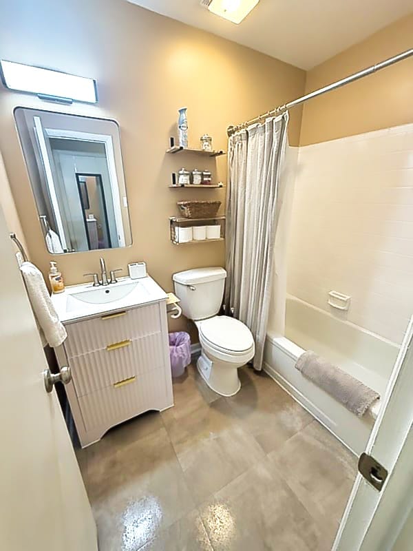 The finished bathroom with new vanity and painted tile