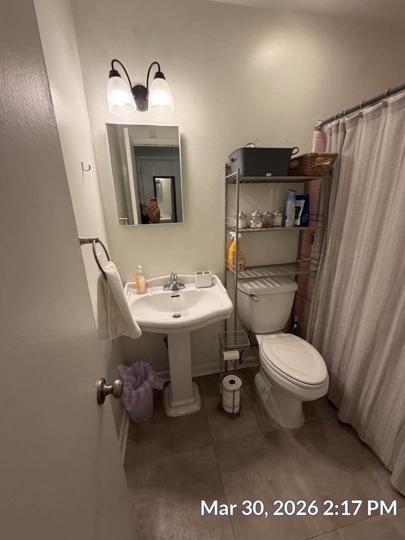 Bathroom with original fixtures and tile