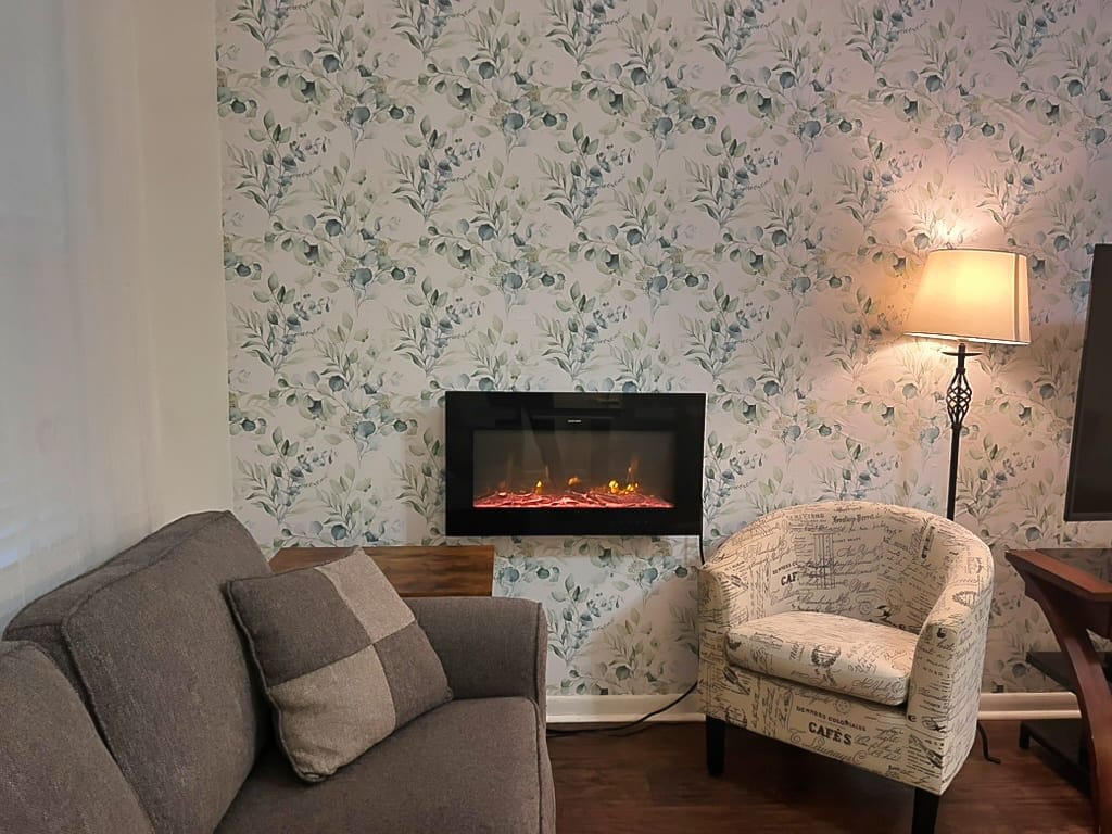 New tropical print wallpaper on the living room wall